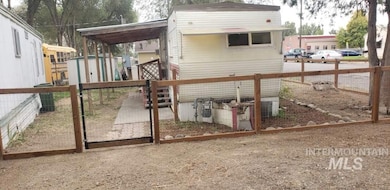 View of jungle gym with a gate