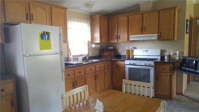 Kitchen boasts lots of cabinet space and new count