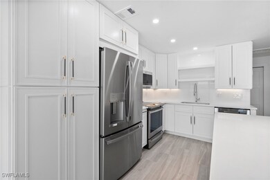 Kitchen featuring light countertops, visible vents