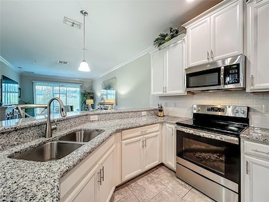 Top section kitchen with all stainless appliances