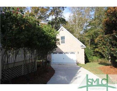 Exterior Front. Detached four car garage