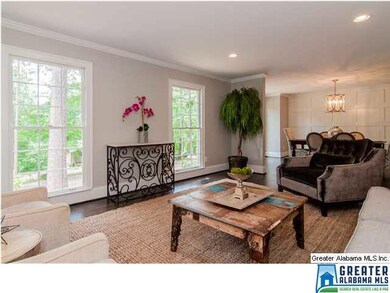 Another view of the living room with floor to ceil