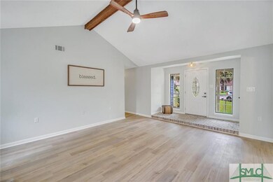 Living room facing the front door and lovely white