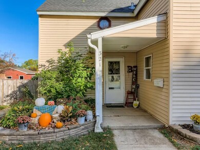Front entrance with retaining wall garden on both 