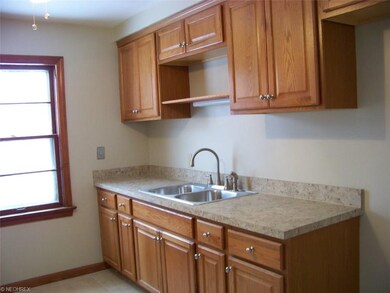 The updated kitchen has new ceramic tile
