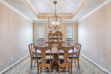 Dining Room with hardwood floors, tray ceiling w/c