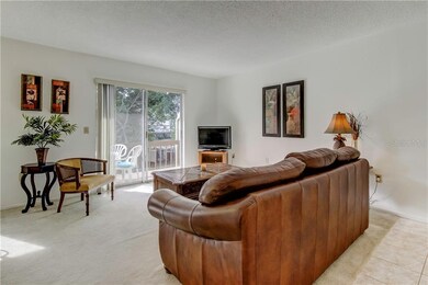 Living room has sliding doors to outside deck.