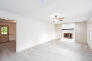 Unfurnished living room with wood finished floors,