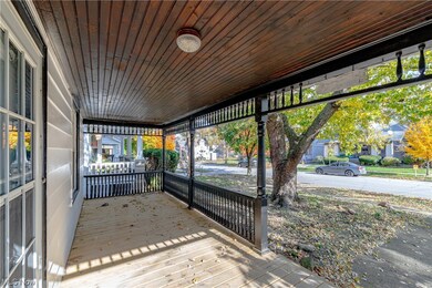 Unfurnished sunroom with wood ceiling