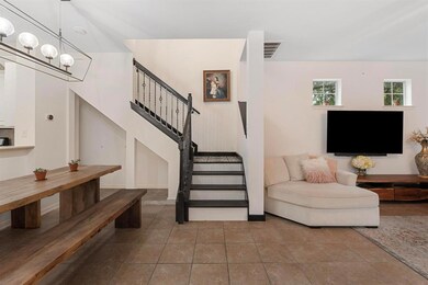 Stairway featuring a chandelier and tile patterne