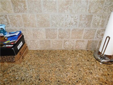 TILE BACKSPLASH COMPLIMENT THE GORGEOUS GRANITE