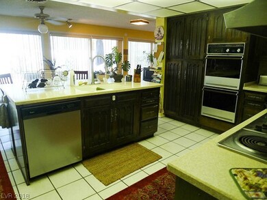 Kitchen features double ovens and a large island.