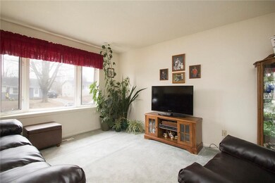 Upstairs living room with large picture window.