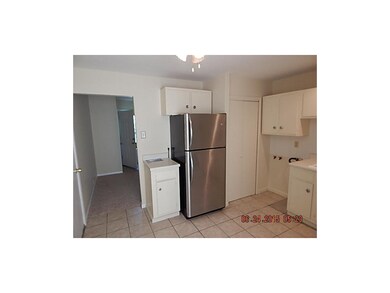 Refrigerator, tile floor in kitchen and small area