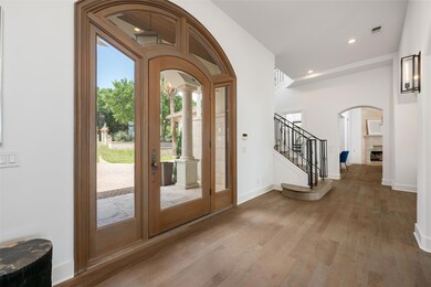 Entrance foyer featuring arched walkways, decorat