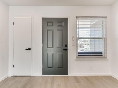 Foyer entrance with light hardwood / wood-style fl