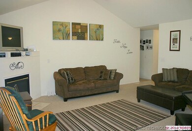 Large living area with vaulted ceiling.