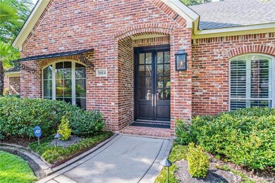 Beautifully landscaped home with welcoming entranc