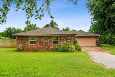 View of front facade featuring concrete driveway, an attached garage, brick siding, and roof with shingles