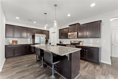 Kitchen featuring visible vents, tasteful backspla