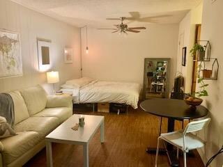 Bedroom featuring wood finished floors and a text