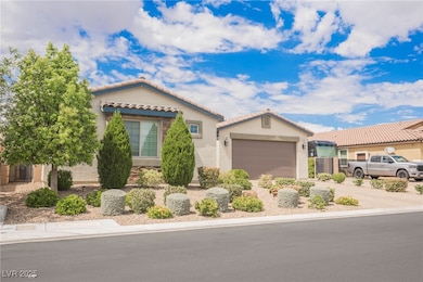 Mediterranean / spanish-style home featuring driveway, stucco siding, a tile roof, and a garage