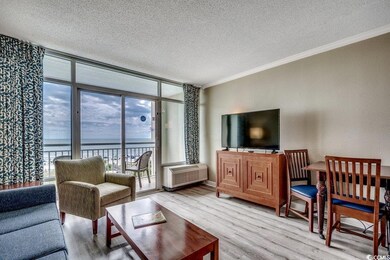 Living room featuring a wall of windows, crown mol