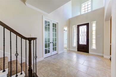 Large, wide foyer with cathedral ceiling.