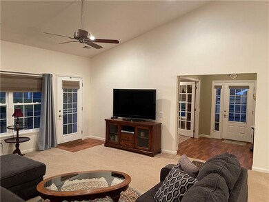 Living Room Opens to Patio Door and Dining Area