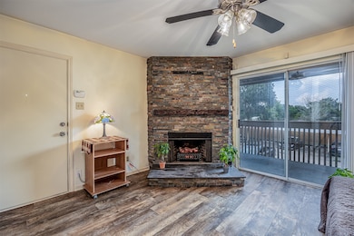 Cozy wood-burning fireplace with a convenient electric insert.