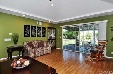 Living Room has Wood Laminate Flooring, French-Sty