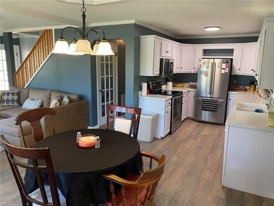 Open floor plan with kitchen and dining