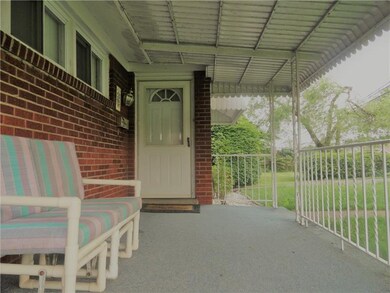 EASY IN AND OUT TO YOUR OUTDOOR, CARPETED OASIS.  