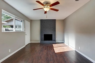 Unfurnished living room featuring wood finished f