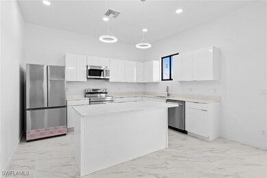 Kitchen with appliances with stainless steel finis