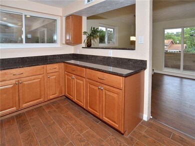 The Kitchen Opens to the Combination Living Room/D