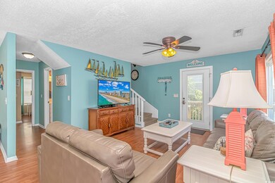 Living room featuring a textured ceiling, ceiling 