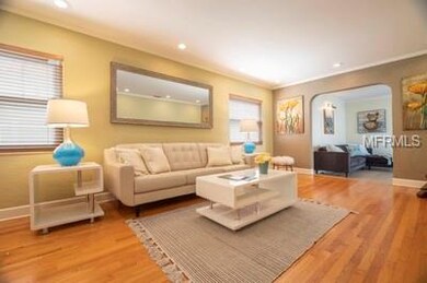 Beautiful hardwood floors with arched doorways = 