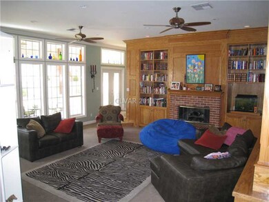 Den. Cozy family room with fireplace and oak built