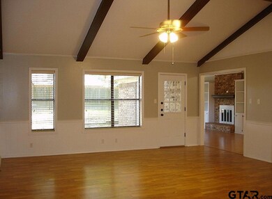 Features beautiful laminate wood floors, vaulted ceiling and great view of back patio& yard.