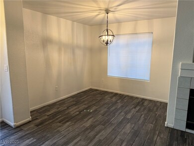 Unfurnished dining area with dark wood-style floor