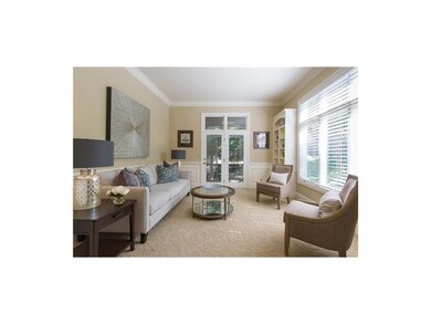 Living room/music room with built in shelves and a