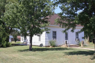 Front and south side view of house