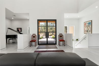 Entrance foyer featuring recessed lighting and estate doors