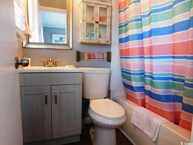 Full bathroom with shower / tub combo and vanity