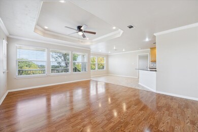 Unfurnished living room featuring a ceiling fan, 