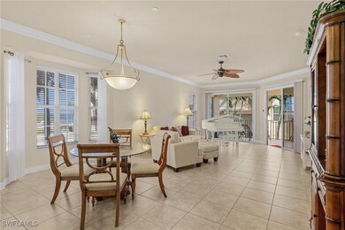 Dining space with light tile patterned floors, orn