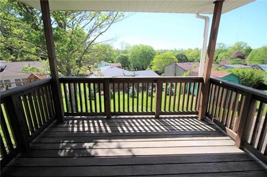 Covered deck located off the kitchen, overlooks th
