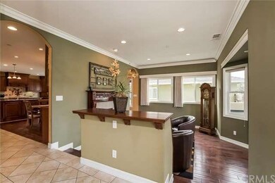 Formal sunken living room off entry with fireplace