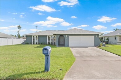 Ranch-style house with a front lawn and a garage